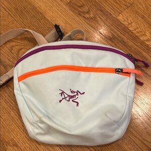 Arc'teryx Cream Backpack with Orange and Purple Accents